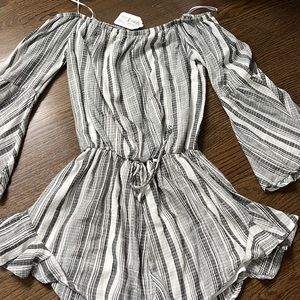 Black and white long sleeve romper. Size small, with tags.